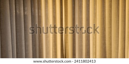 "Radiant and welcoming, this sunlit house curtain creates a warm and inviting atmosphere. Purchase this image and illuminate your projects with luminosity and comfort!" Royalty-Free Stock Photo #2411802413