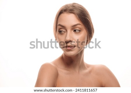 Beauty portrait of a blonde girl on a white isolated background. Skin care concept. Cosmetology. Tender skin