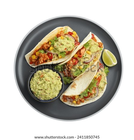 Delicious tacos with guacamole, meat, vegetables and slice of lime isolated on white, top view
