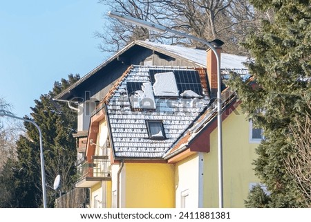 In winter, solar panels on the roof collect solar energy, an additional resource of electricity.