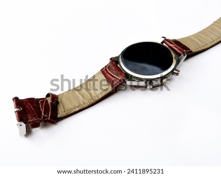 Timepiece wrist watch with leather strap band, timewatch dresswatch fashionwatch symbol of style fashion and elegance montre-bracelet, relojde pulsera, relogio pulso, gharee photo  Royalty-Free Stock Photo #2411895231