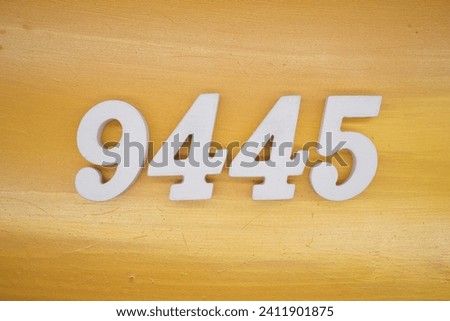 The golden yellow painted wood panel for the background, number 9445, is made from white painted wood.