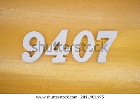 The golden yellow painted wood panel for the background, number 9407, is made from white painted wood.