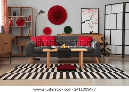 Interior of festive living room with cozy sofa and decor for Chinese New Year celebration