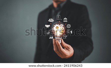 Businessman hand with light bulb, internet solution connection idea concept. Business global internet network application technology, digital marketing tech. Financial banking, computer big data icon