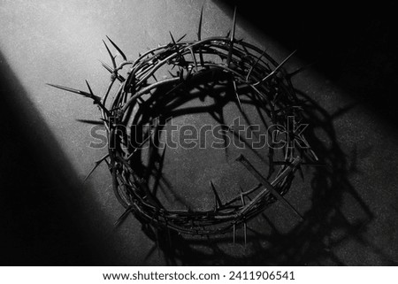 Crown of thorns with nails on dark background. Good Friday concept Royalty-Free Stock Photo #2411906541