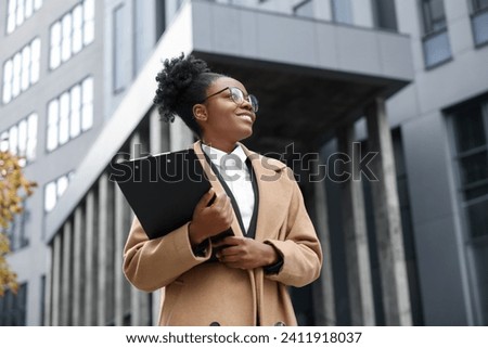 Happy woman with clipboard outdoors. Lawyer, businesswoman, accountant or manager
