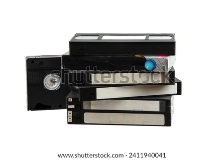 Pile of VHS video cassettes. Vintage media. Isolate on a white background. Royalty-Free Stock Photo #2411940041