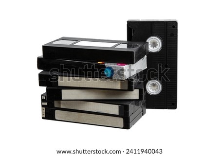 Pile of VHS video cassettes. Vintage media. Isolate on a white background. Royalty-Free Stock Photo #2411940043