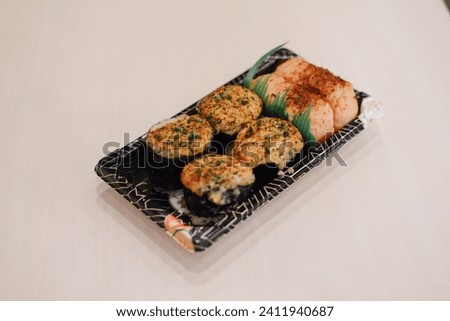 Japanese food, sushi and rolls in a box on a white background