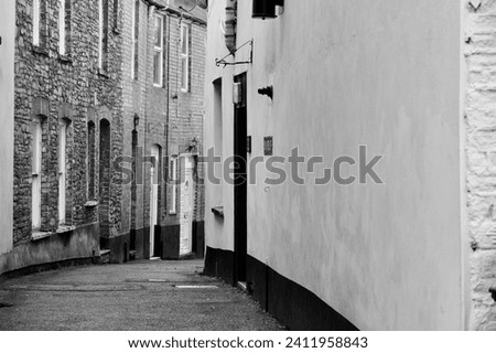 The streets in the centre of the town of Brecon are narrow and the architecture styles reflect the long and mixed history of this settlement in the heart of the Brecon Beacons National Park Royalty-Free Stock Photo #2411958843