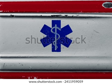 Symbol of medicine on the dirty metallic surface