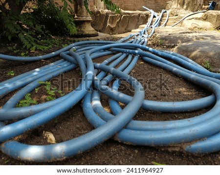 blue water hose. The length is approximately 10 meters