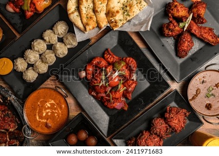 Indian and Nepalese food flat lay composition Royalty-Free Stock Photo #2411971683