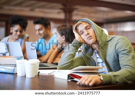 Tired, study group or portrait of student in library with burnout, depression or low energy. Lazy man, university or exhausted person bored by books with fatigue or adhd with people for teamwork