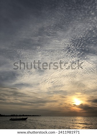 Beatiful landscape sea with cloudy skies in sunset and boat