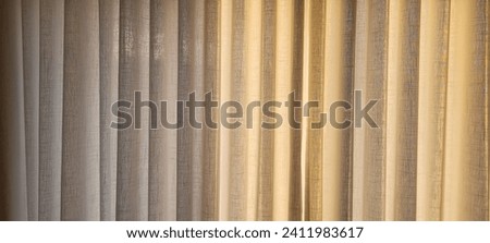 "Radiant and welcoming, this sunlit house curtain creates a warm and inviting atmosphere. Purchase this image and illuminate your projects with luminosity and comfort!" Royalty-Free Stock Photo #2411983617