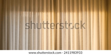 "Radiant and welcoming, this sunlit house curtain creates a warm and inviting atmosphere. Purchase this image and illuminate your projects with luminosity and comfort!" Royalty-Free Stock Photo #2411983933