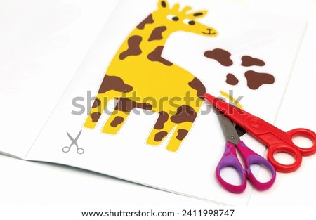  Child development concept. Peper cut out picture for kids with scissors. High quality photo 