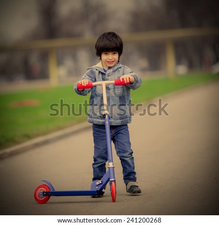 a boy with a new scooter on open air, instagram image style