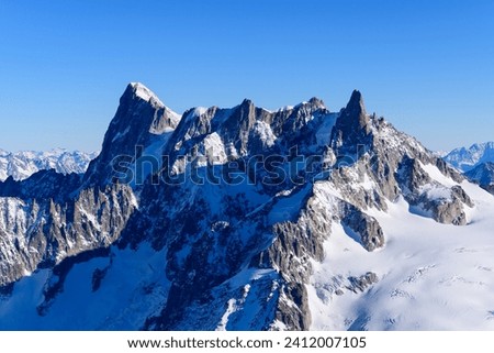 Grandes Jorasses, Dent and Glacier du Géant, Aiguilles Marbrées in Europe, France, Rhone Alpes, Savoie, Alps in winter on a sunny day.