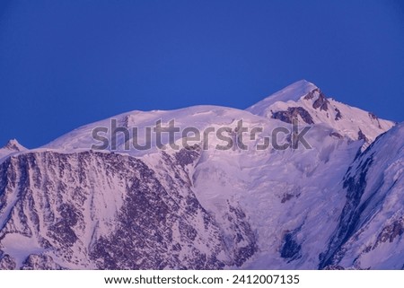 Mont Blanc massif at blue hour in Europe, France, Rhone Alpes, Savoie, Alps, winter.