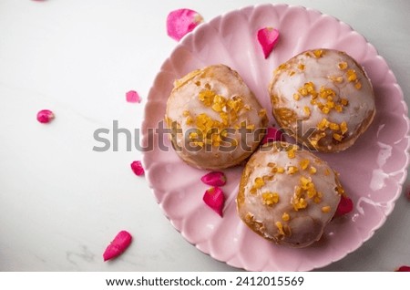Polish donuts with icing, Fat Thursday Royalty-Free Stock Photo #2412015569
