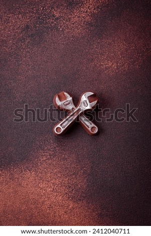 Tools and inscriptions symbolizing repairs or a garage and its attributes on a plain background. Background for your design