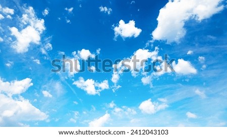 Blue sky panorama with white clouds, natural abstract background. Beautiful panoramic view of soft puffy clouds, natural wallpaper design, screensaver template