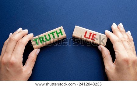 Truth or Lie symbol. Concept word Truth or Lie on wooden blocks. Businessman hand. Beautiful deep blue background. Business and Truth or Lie concept. Copy space