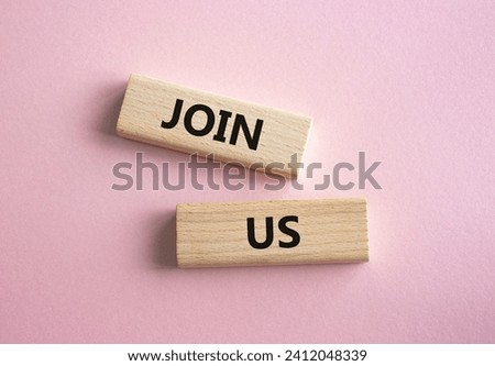 Join us symbol. Concept word Join us on wooden blocks. Beautiful pink background. Business and Join us concept. Copy space