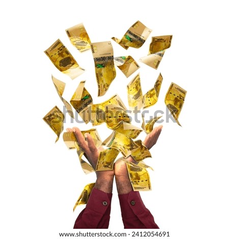 Ugandan shilling notes falling in black male hands isolated on white background. 3d rendered banknotes Royalty-Free Stock Photo #2412054691