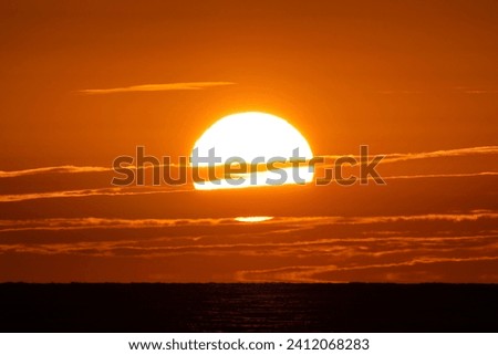 Dramatic summer sun setting over Lake Michigan