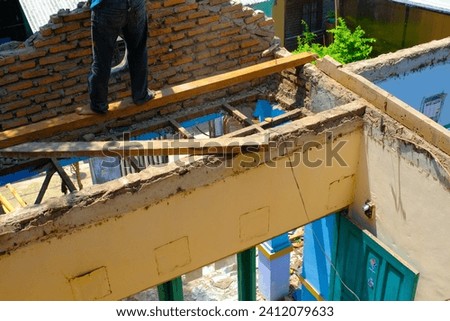 Industrial Photography. Construction Works. Photo of a house whose roof was removed. Roof removal for metal deck installation. Bandung, Indonesia