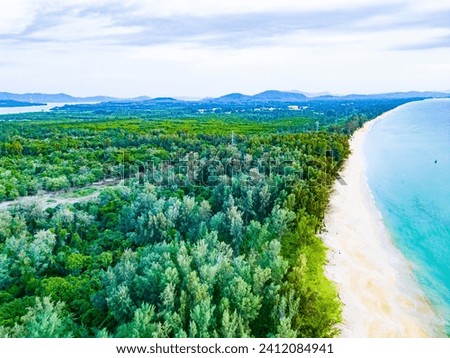 Kilometers of deserted sandy beaches framed by coniferous forests of the northern tip of Phuket
