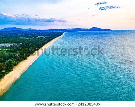 Kilometers of deserted sandy beaches framed by coniferous forests of the northern tip of Phuket