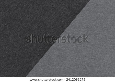 Texture of craft black and dark green paper background, half two colors, macro. Vintage dense kraft teal cardboard. stock photo Royalty-Free Stock Photo #2412093275