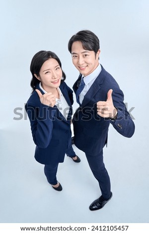 Young office worker couples wear suits and express various emotions with facial expressions and hand gestures. Royalty-Free Stock Photo #2412105457
