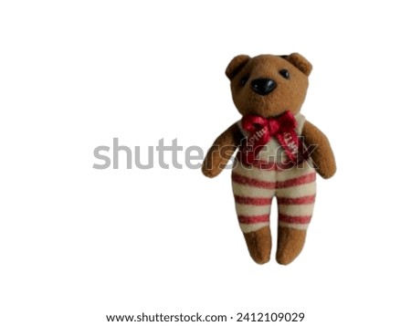 A cute brown bear doll. "I love you" present. With copy space on white background.