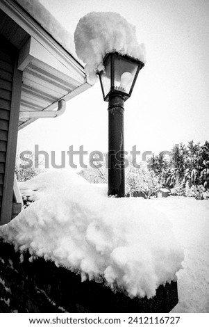 Heavy Layers Of Snow Stacked On A Lamp Post In The Illinois Quad Cities Country Blizzard of January 2024