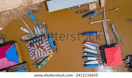 Aerial view of vibrant boats docked at the Amazon River in Leticia, Colombia