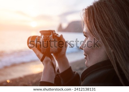 Woman travel sea. Happy tourist enjoy taking picture outdoors for memories. Woman traveler looks at sea bay of mountains, sharing travel adventure journey