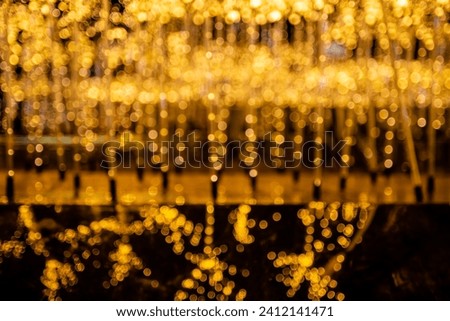 Defocus or blur image, background texture with bokeh lighting effects during Christmas season
