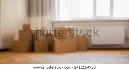 Stack of cardboard boxes with household