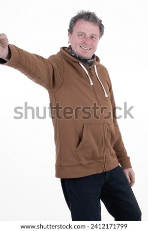 middle aged selfie phone good mood satisfied handsome man dressed brown hoodie making picture selfie hold smartphone on white background