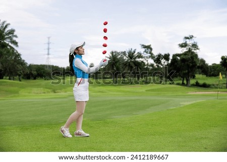 Portrait of young asian female golfer throw a red heart and holding at the course over white sky background, stacking pictures, concept