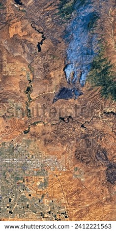 Bush Fire Scorches Lands Near Phoenix. The blaze is the largest in Arizona this year and the largest in the United States right now. Elements of this image furnished by NASA.