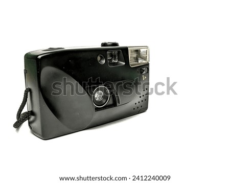 An old analog camera, using film tape, isolated on a white background