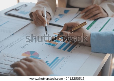 
Team of business people working together in the meeting room office, teamwork background charts and graphs banner, double exposure successful teamwork,business planning concept.