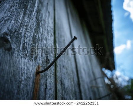 old wooden fence in countryside garden with rotten planks